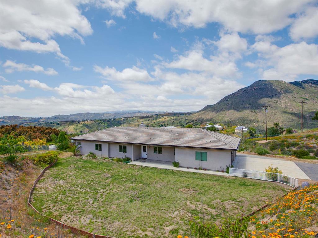 2918 Vista Del Rio Fallbrook, CA 92028 - Photo 1 of 1 a aerial view of a house next to a big yard and large trees