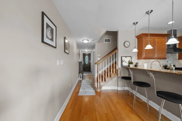 a hallway with a dining table chairs and entryway