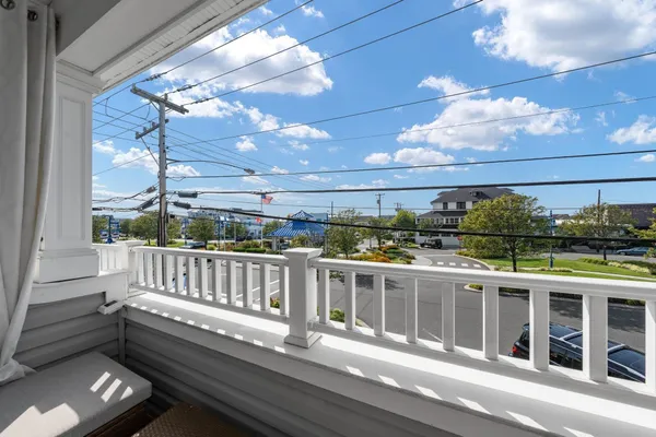a view of balcony with furniture