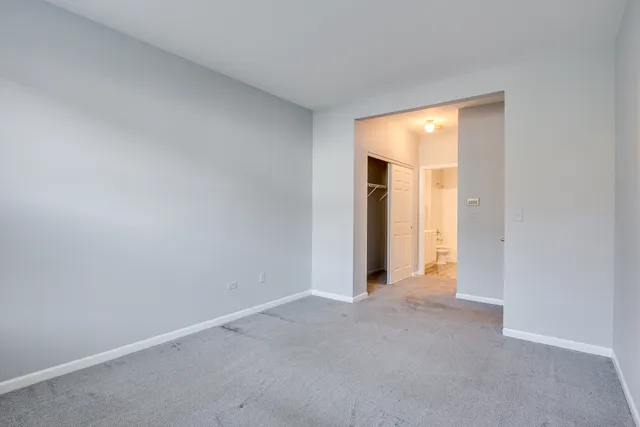 a view of an empty room and a window