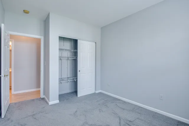 a view of an empty room and fire place