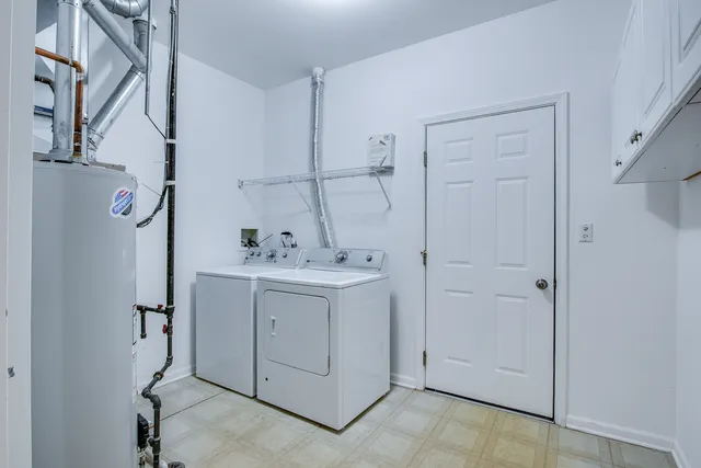 a utility room with cabinets