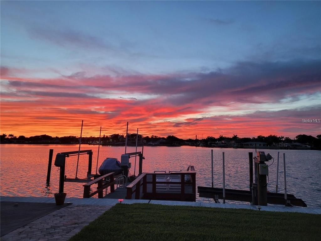 512 20th Avenue Indian Rocks Beach, FL 33785 - Photo 17 of 17 a view of a lake with a table under an umbrella