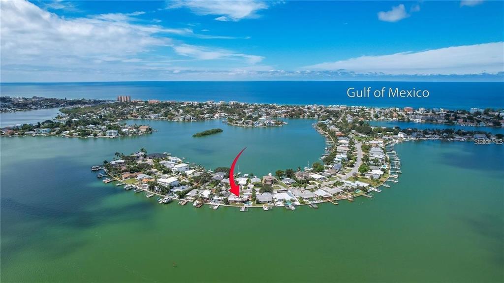 512 20th Avenue Indian Rocks Beach, FL 33785 - Photo 4 of 17 a view of a lake with a house