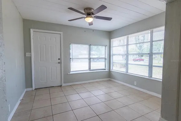 a view of an empty room with a window