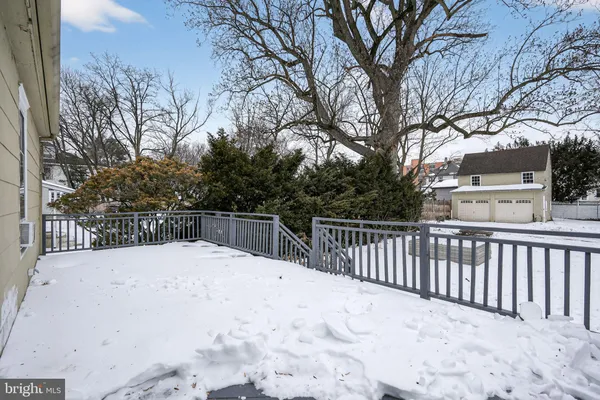 a view of balcony with wooden fence