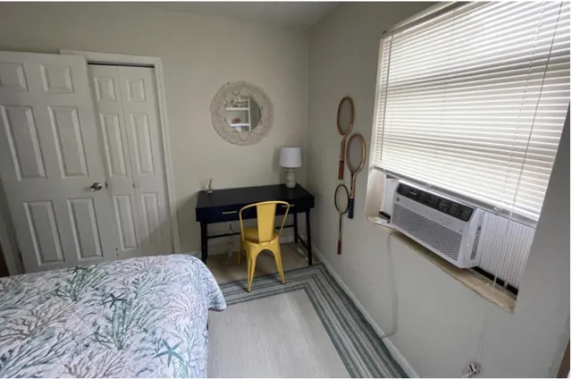 a bedroom with a bed and a cabinets