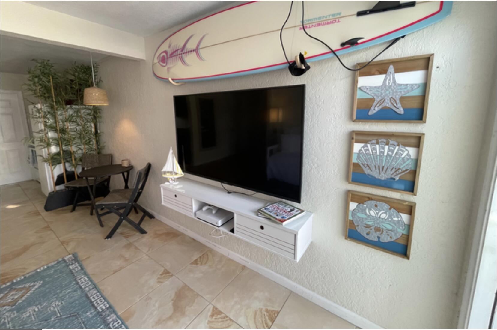 350 Northwest 5th Avenue Delray Beach, FL 33444 - Photo 3 of 15 a living room with furniture and a flat screen tv