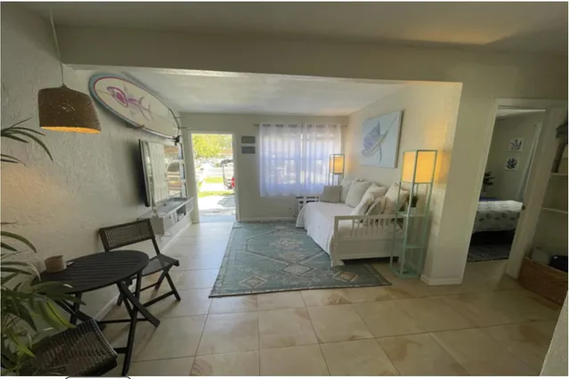 a living room with furniture and a rug