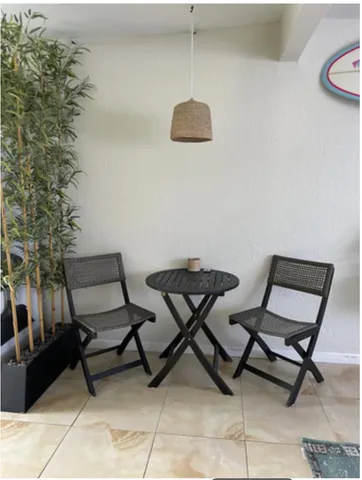 a view of a room with chairs and a table