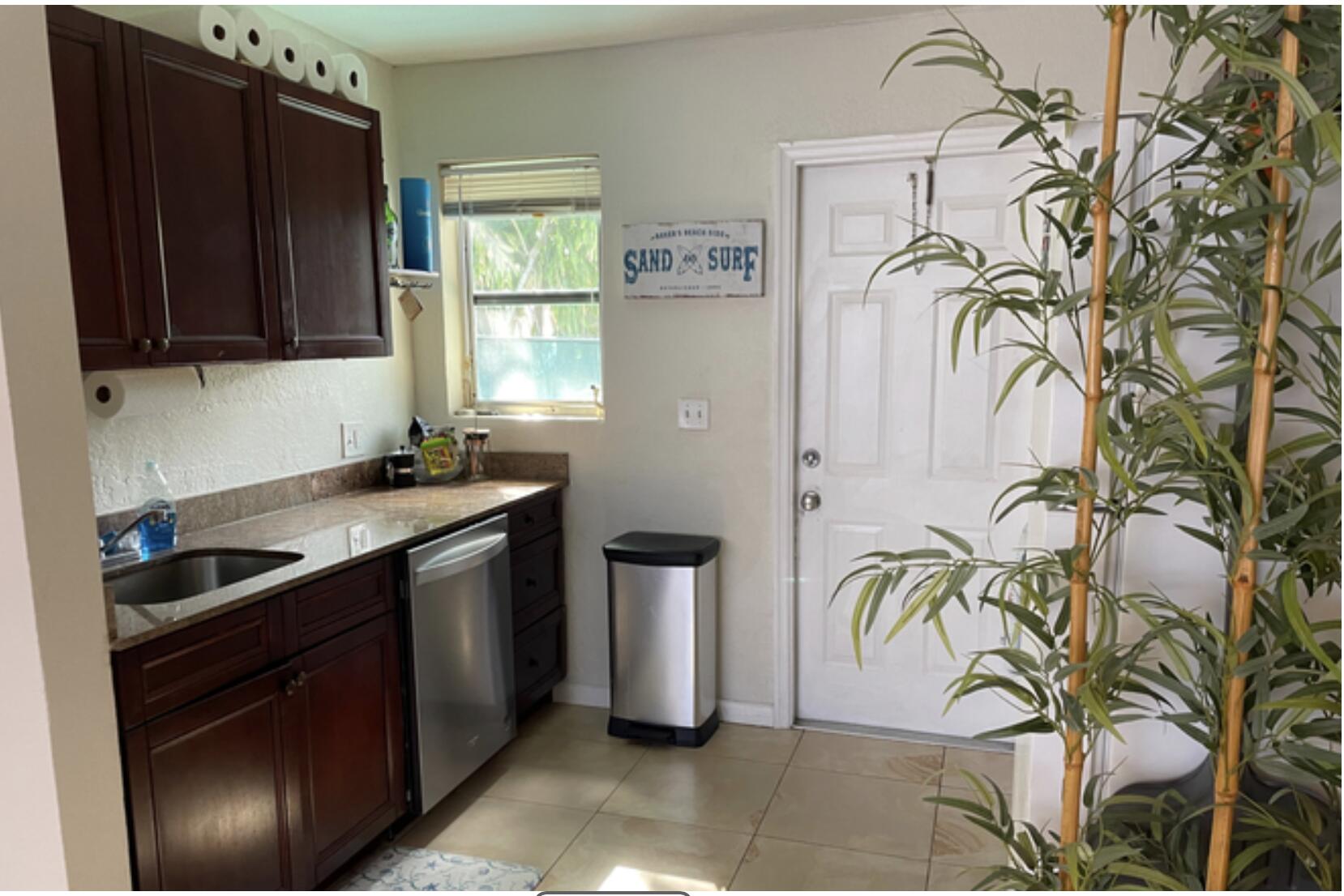 350 Northwest 5th Avenue Delray Beach, FL 33444 - Photo 8 of 15 a kitchen with a sink and cabinets