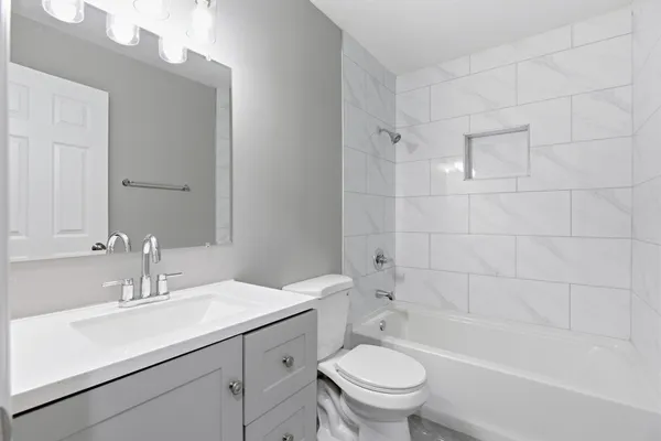 a bathroom with a sink toilet and bathtub