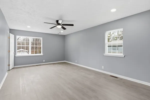 a view of an empty room with a window