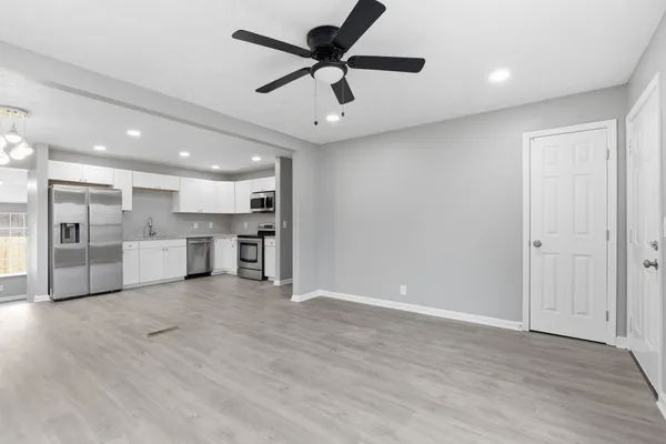 a view of a kitchen with a sink and a window
