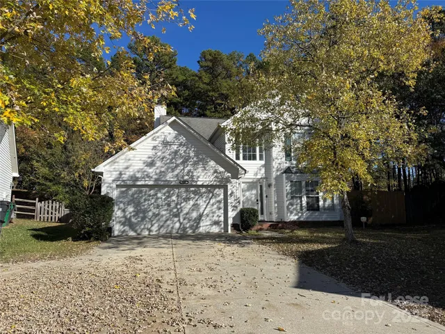 a view of a yard with a tree