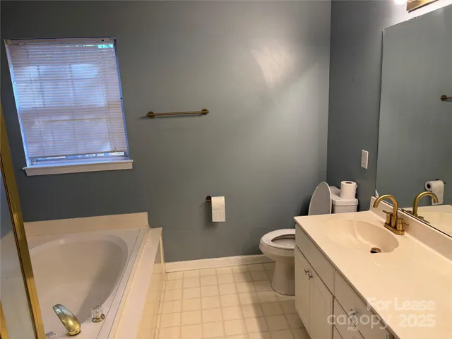 a bathroom with a sink a toilet and bathtub