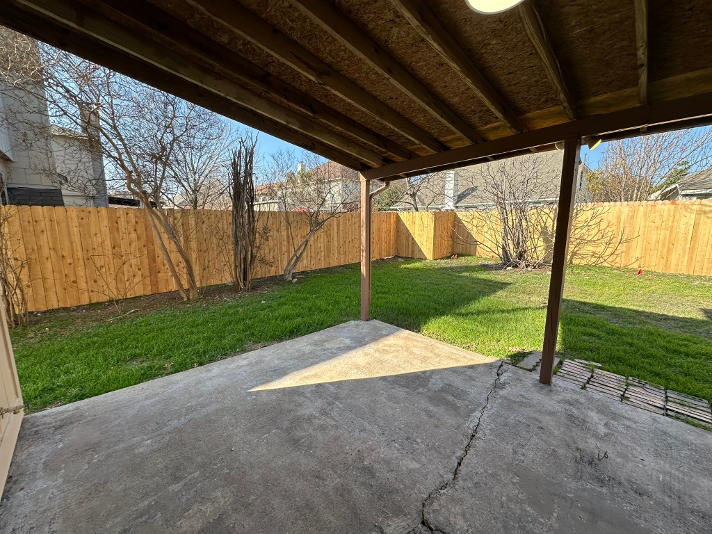 814 Smoke Signal Pass Pflugerville, TX 78660 - Photo 13 of 29 Fenced backyard with a patio