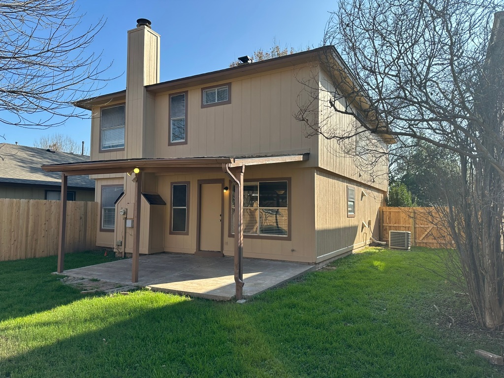 814 Smoke Signal Pass Pflugerville, TX 78660 - Photo 16 of 29 Rear view of property featuring a patio area, a fenced backyard, and a chimney