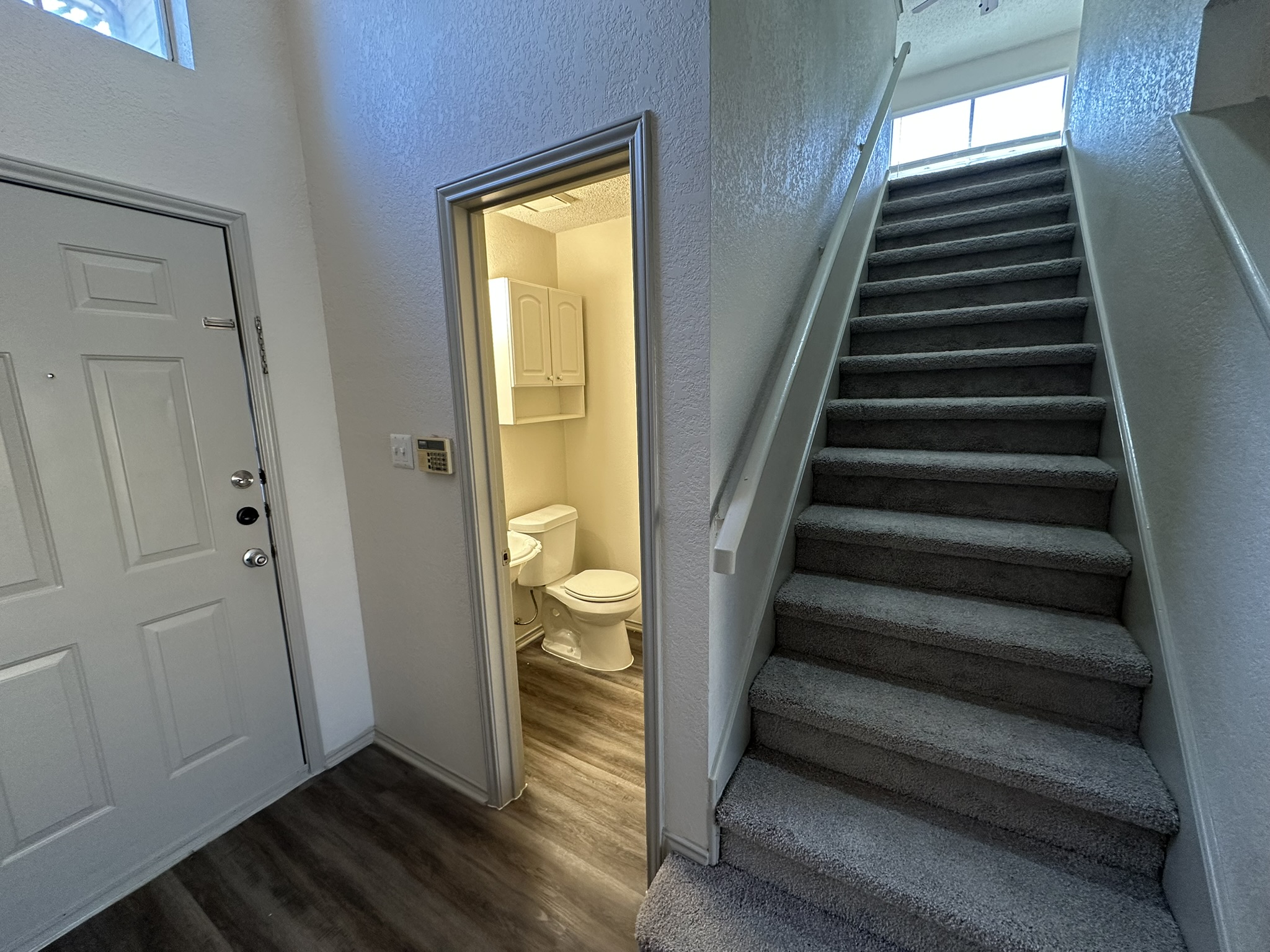 814 Smoke Signal Pass Pflugerville, TX 78660 - Photo 4 of 29 Staircase, half bath, foyer