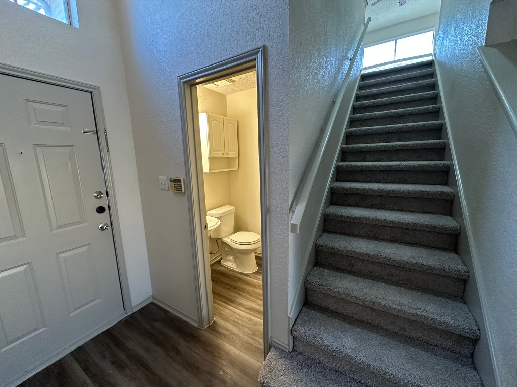 814 Smoke Signal Pass Pflugerville, TX 78660 - Photo 4 of 29 Staircase, half bath, foyer