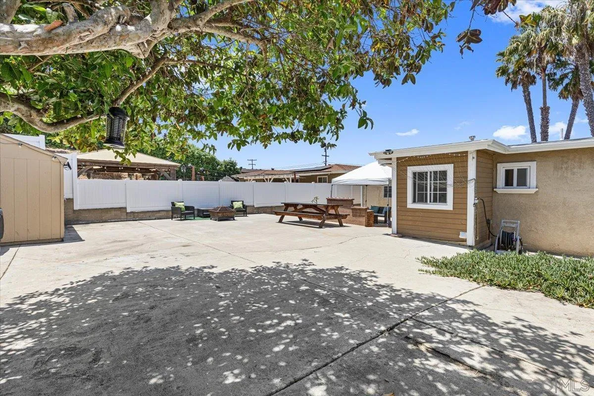 6295 Calle Pavana San Diego, CA 92139 - Photo 24 of 27 a view of a house with a yard and tree