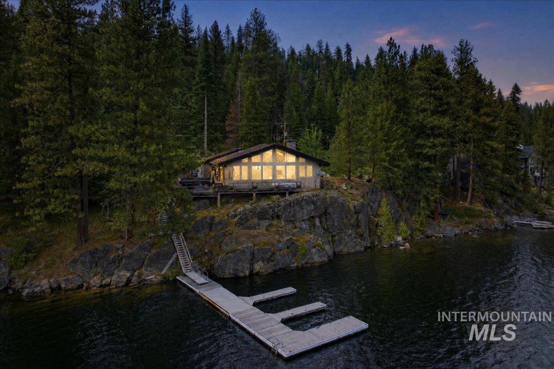 3800 Warren Wagon Road McCall, ID 83638 - Photo 1 of 50 Waterfront property featuring a sloped A-frame roofline, extensive decking, and a private dock system