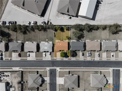 an aerial view of multiple houses with outdoor space
