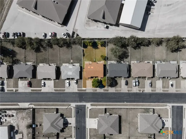 an aerial view of multiple houses with outdoor space