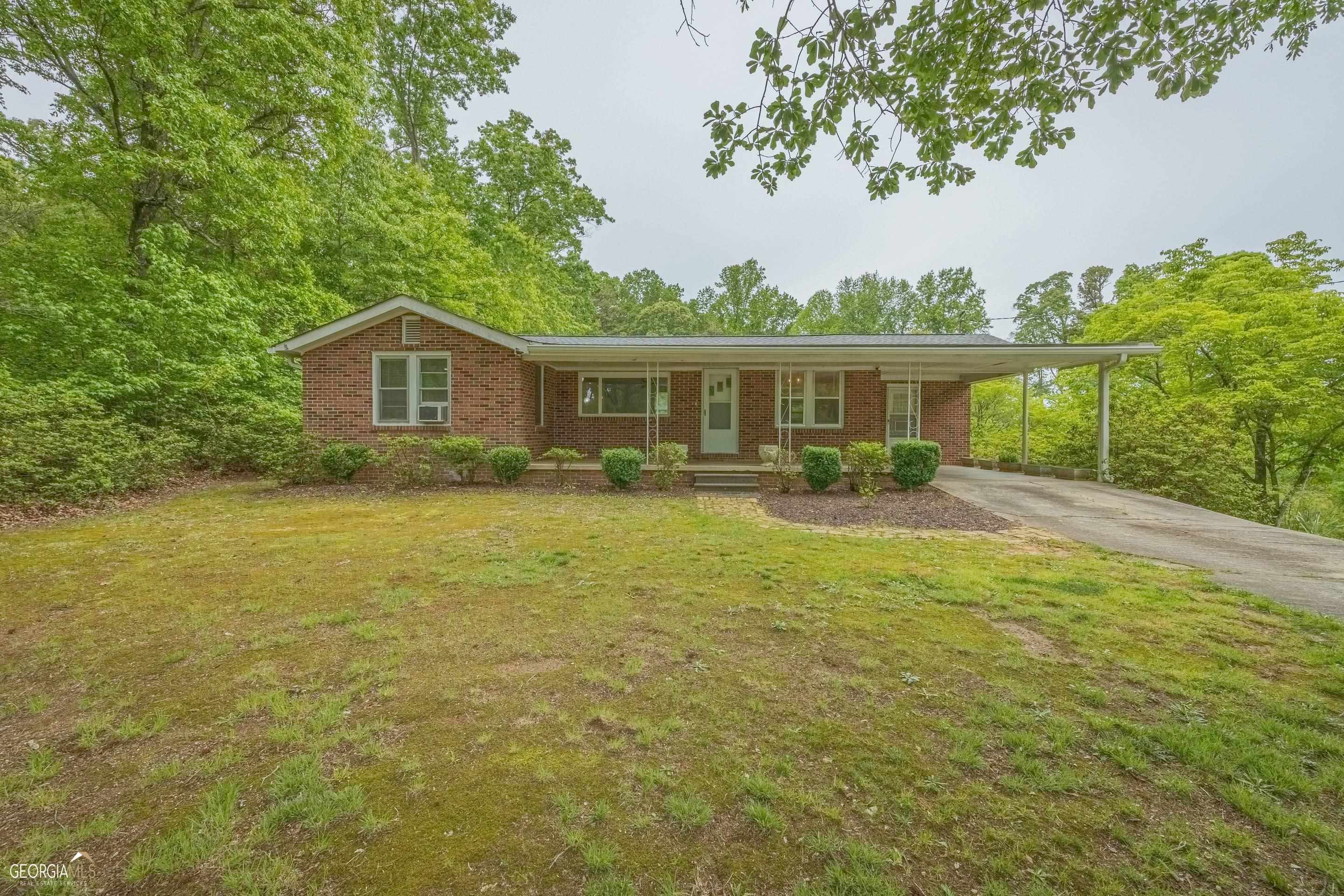 364 Fieldale Road Toccoa, GA 30577 - Photo 1 of 1 a front view of a house with yard and green space