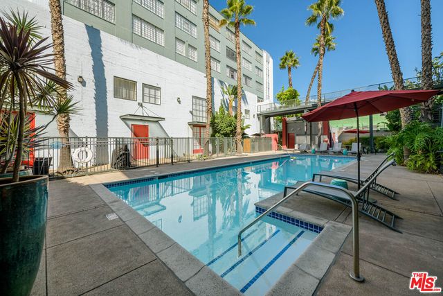 a balcony with furniture and a potted plant