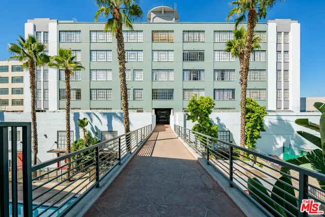 a view of a buildings with many windows