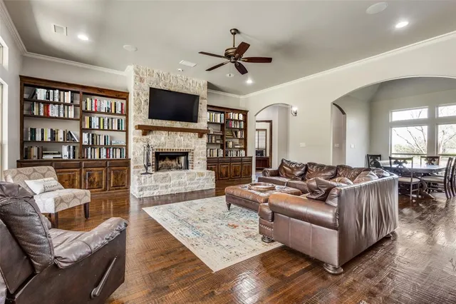 a living room with furniture fireplace and flat screen tv