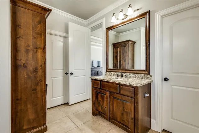 a bathroom with a sink vanity and a mirror