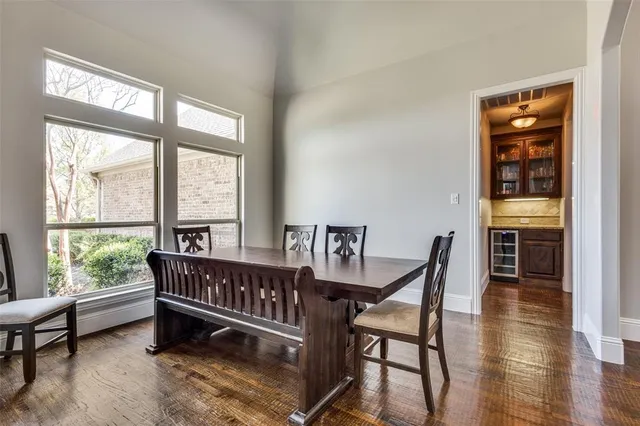 a dining room with furniture and windows