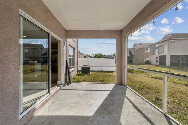 a kitchen with stainless steel appliances a sink a stove a refrigerator and cabinets