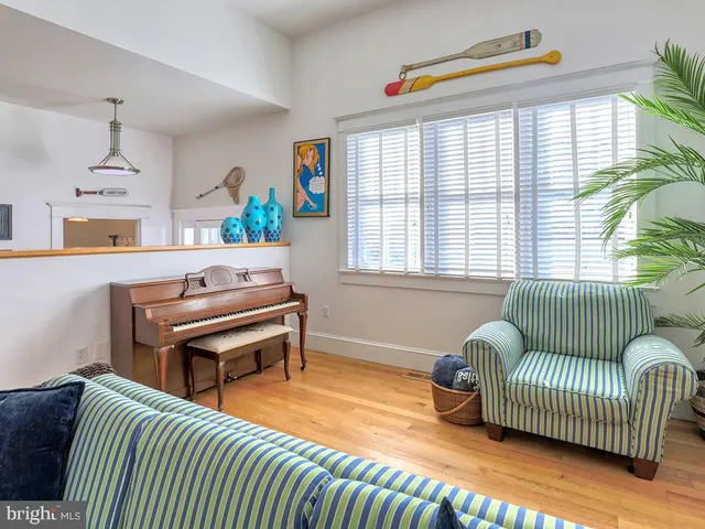 a kitchen with a stove a sink a microwave and cabinets