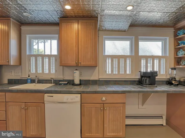 a living room with furniture fireplace and window