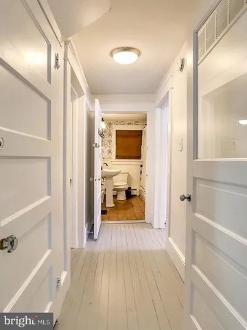 a spacious bedroom with a bed and a window