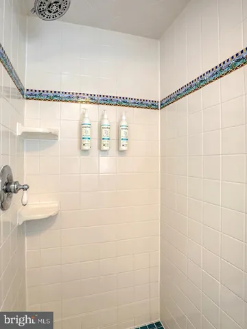 a view of a house with swimming pool and sitting area