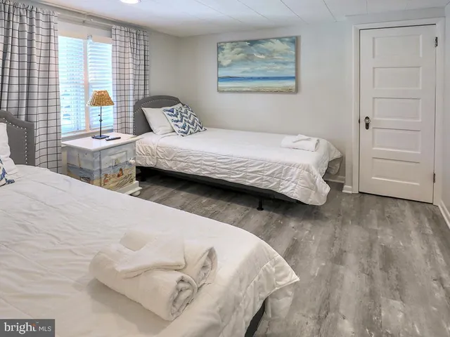 an aerial view of a house with a yard and potted plants