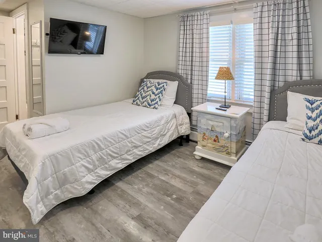 an aerial view of a house with a yard and potted plants