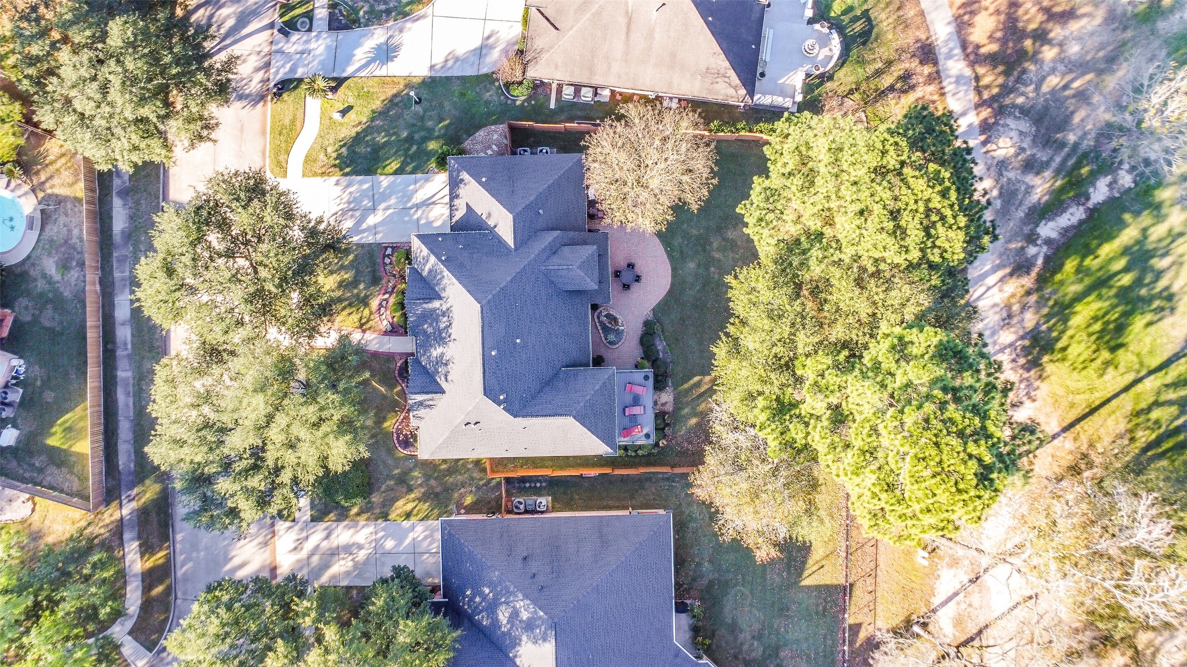 25247 Bull Ridge Drive Porter, TX 77365 - Photo 39 of 50 View over the home: You can see the balcony, and patio - still leaving a lot of room in the backyard for a pool. This is hole #16 on the Oakhurst Golf Course