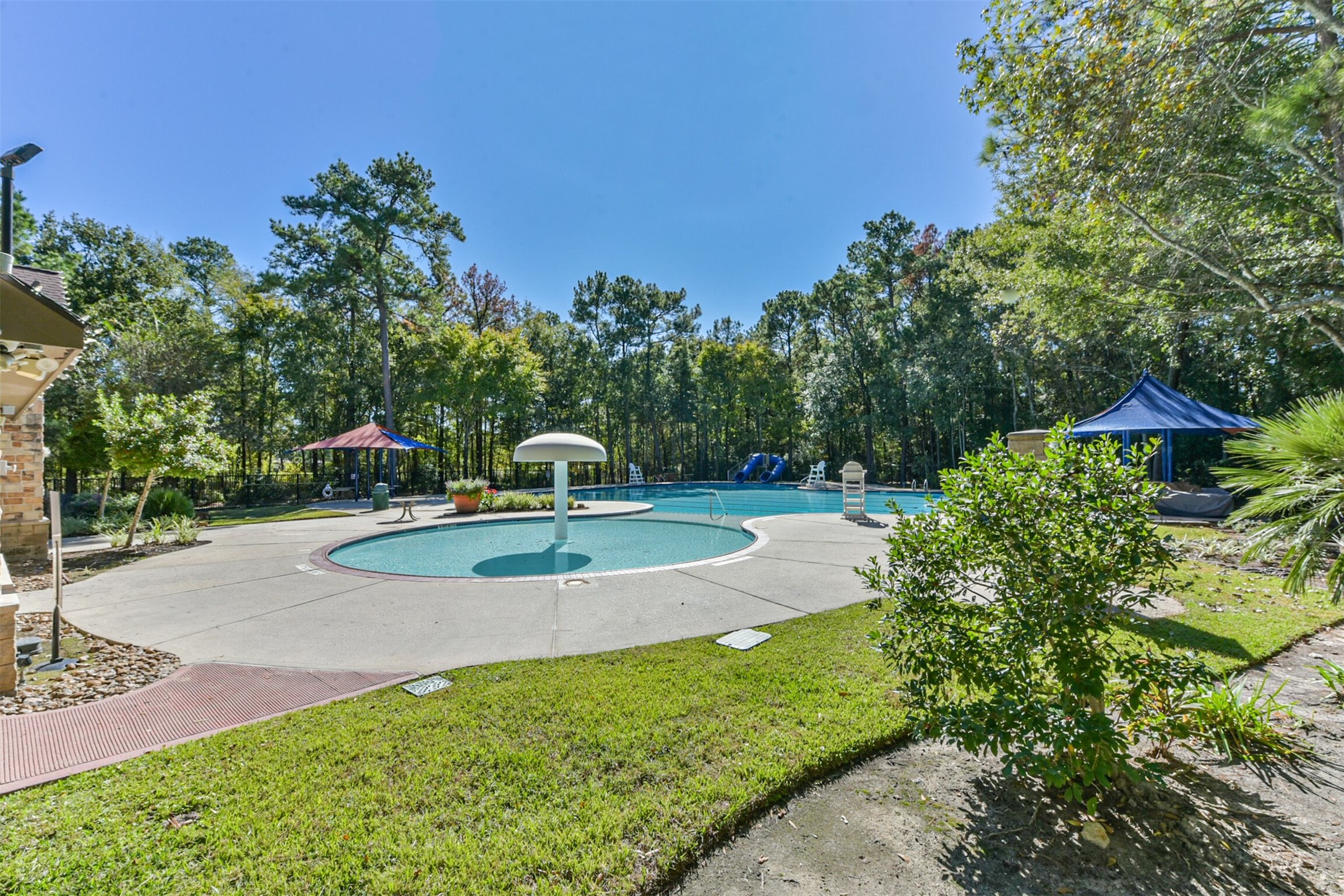 25247 Bull Ridge Drive Porter, TX 77365 - Photo 47 of 50 Community pool, splash pad, walking trails, and community parks are some of the perks t living in OAKHURST