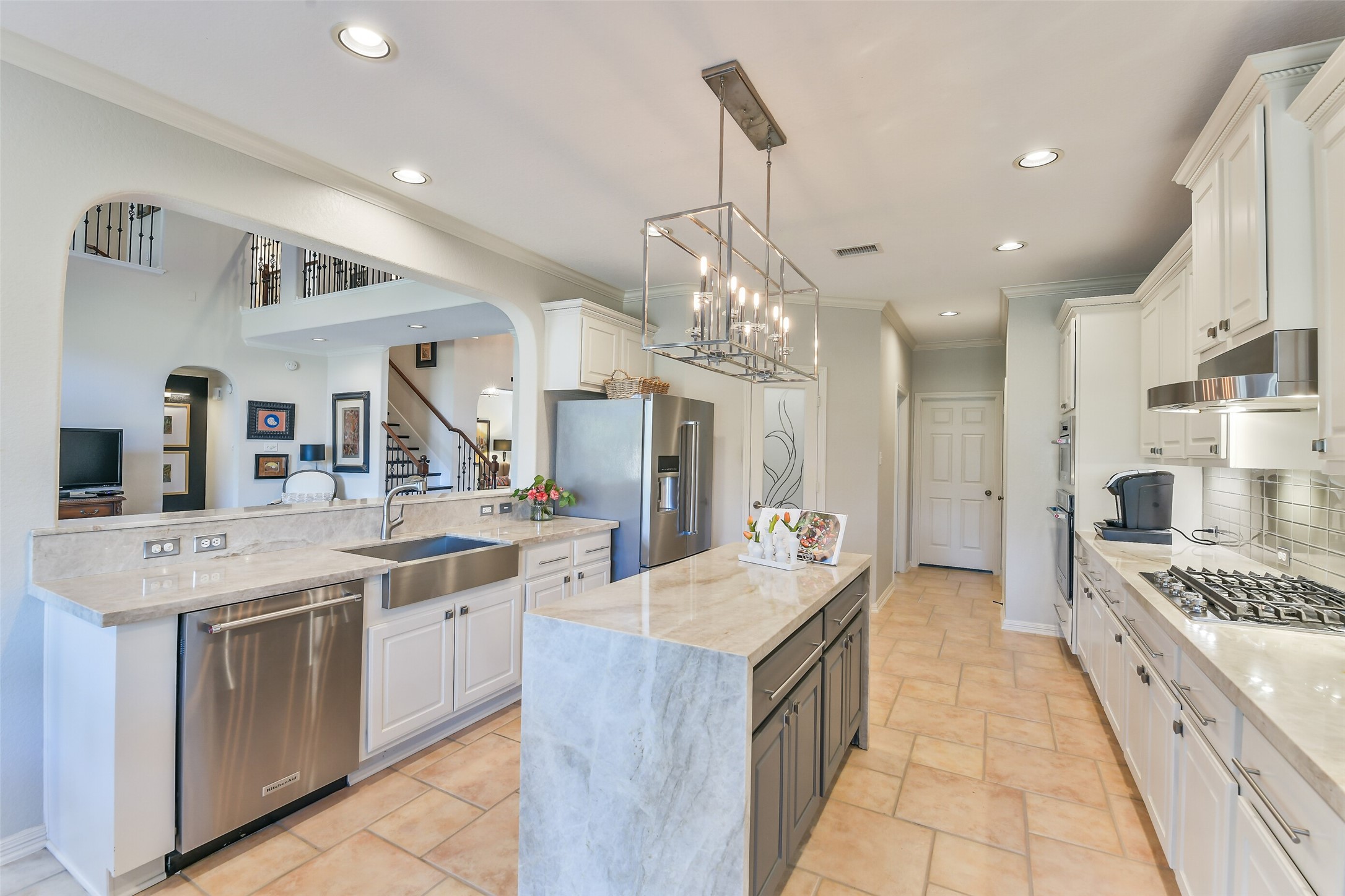 25247 Bull Ridge Drive Porter, TX 77365 - Photo 10 of 50 Updated kitchen including a waterfall island and Taj Mahal quartzite.