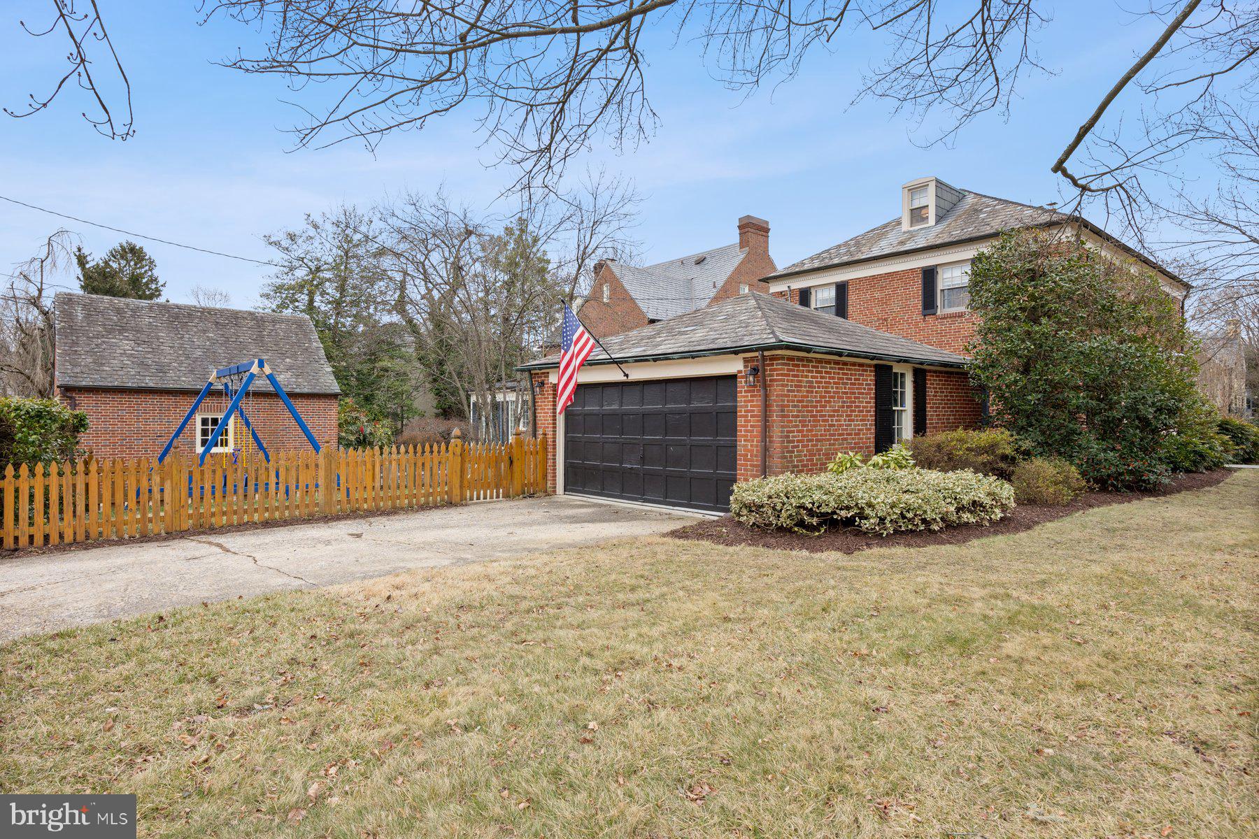 5317 Springlake Way Baltimore, MD 21212 - Photo 36 of 47 a front view of a house with a yard and garage