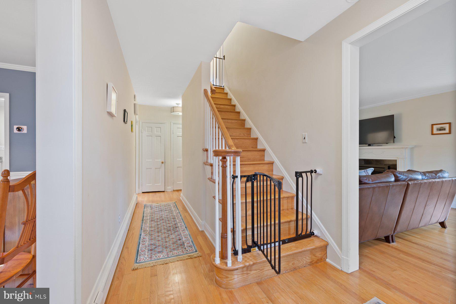 5317 Springlake Way Baltimore, MD 21212 - Photo 8 of 47 a view of a hallway with wooden floor and staircase