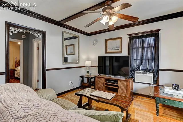 a bedroom with furniture or bed and a flat screen tv