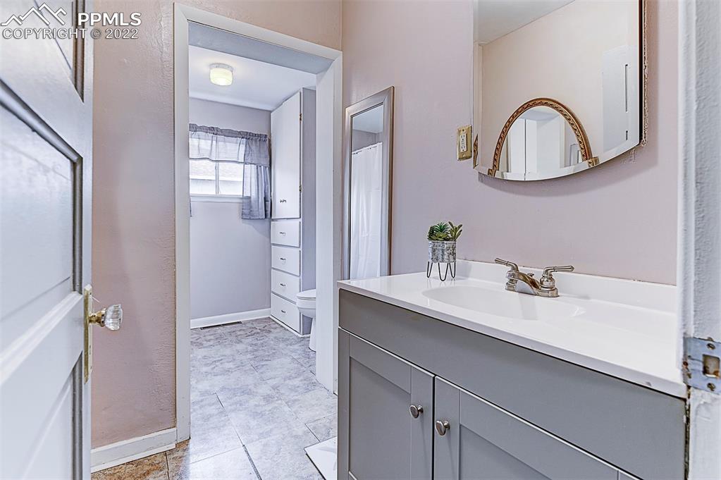 312 10th Street Fowler, CO 81039 - Photo 15 of 35 a bathroom with a sink and a mirror