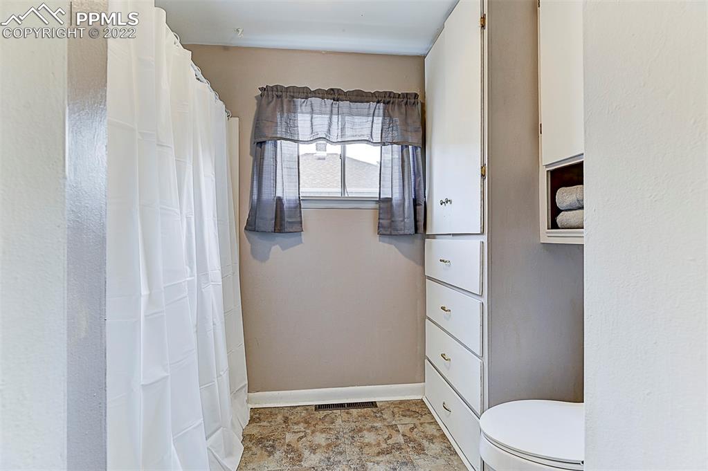 312 10th Street Fowler, CO 81039 - Photo 16 of 35 a bathroom with a toilet and a shower