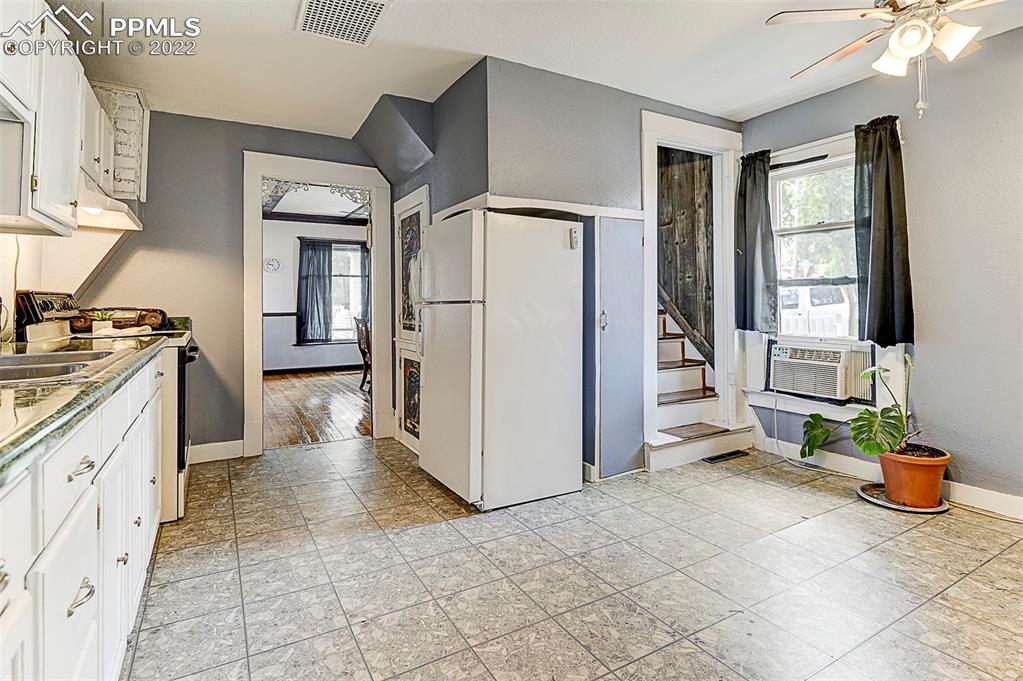 312 10th Street Fowler, CO 81039 - Photo 20 of 35 a kitchen with stainless steel appliances granite countertop a stove a sink and a refrigerator
